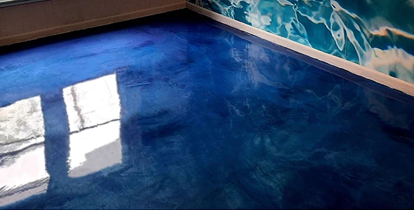 Metallic epoxy flooring with blue tones.