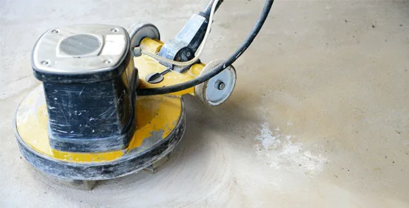 Concrete polishing machine in action.