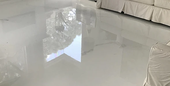 Applying epoxy flooring in residential space in Boulder, Colorado.