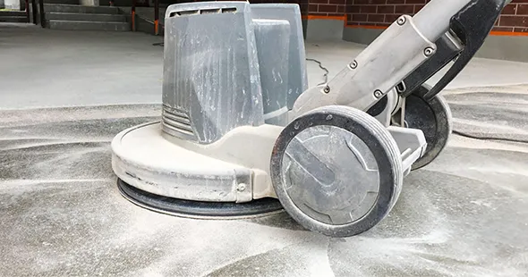 Concrete grinding machine preparing surface in Martinsburg, West Virginia.