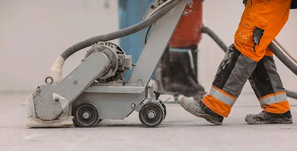 Technician using concrete polishing equipment for services in Bridgeport, WV.