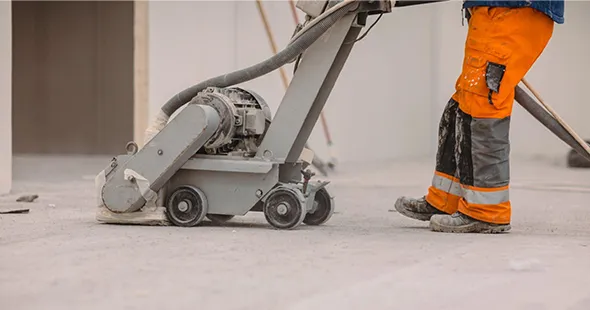 Technician using concrete polishing machine in Bridgeport, West Virginia.