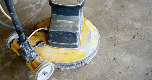 Concrete sealing machine protecting floors in Winchester, Virginia.