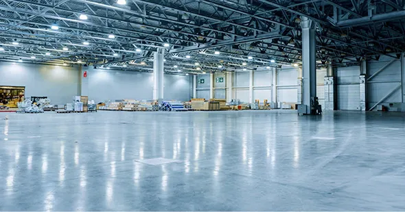 Spacious warehouse interior with newly installed epoxy flooring in Colorado Springs, Colorado.