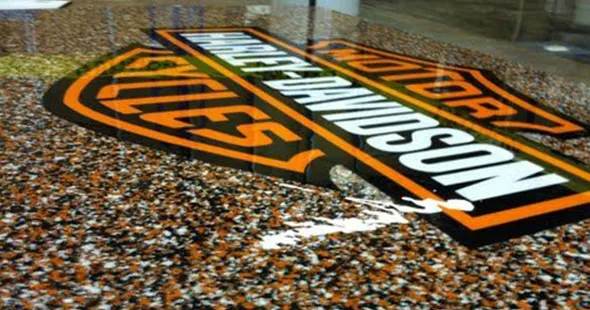 Custom logo of company on epoxy floor in Aurora, Colorado.